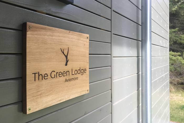Oak signs for The Green Lodge Aviemore